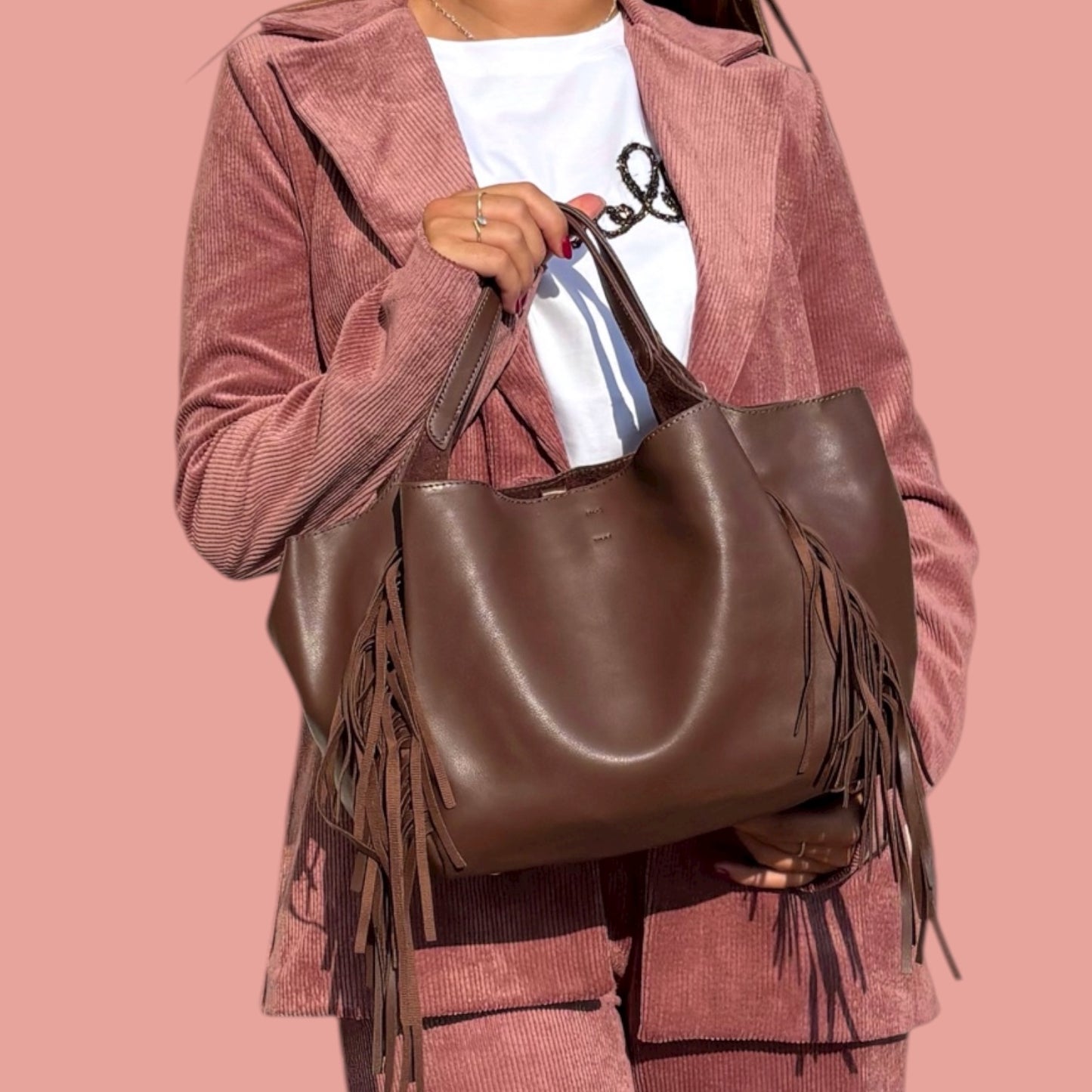 Fruscio borsa in ecopelle con frange